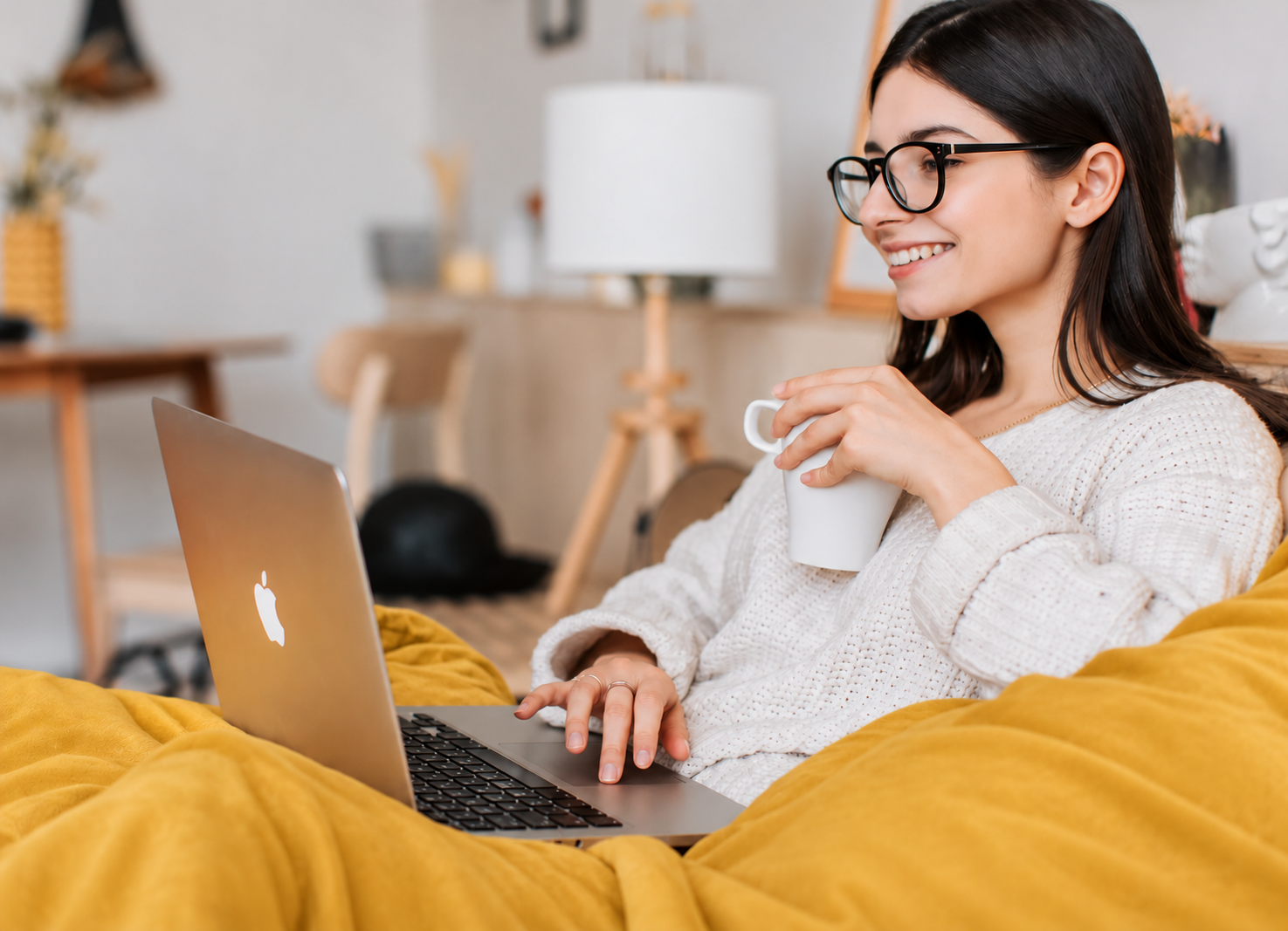 A learner studying at home with a laptop